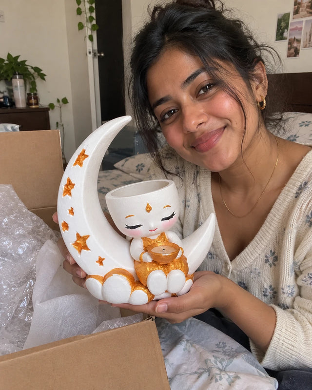 A MiniKin customer showing a Festival Moon Planter at home