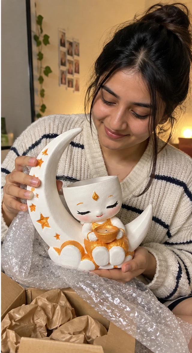 A MiniKin customer unwrapping a Festival Moon Planter